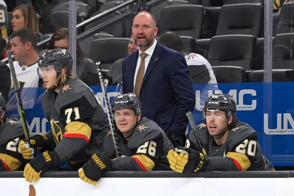 FILE - Vegas Golden Knights coach Peter DeBoer watches from the bench during the third period of the team's NHL hockey game against the Nashville Predators on Thursday, March 24, 2022, in Las Vegas. The Vegas Golden Knights have fired coach Peter DeBoer after they missed the playoffs for the first time in franchise history. General manager Kelly McCrimmon says the front office believes a new coach would put the team in the best position to succeed next season. (AP Photo/David Becker, File)