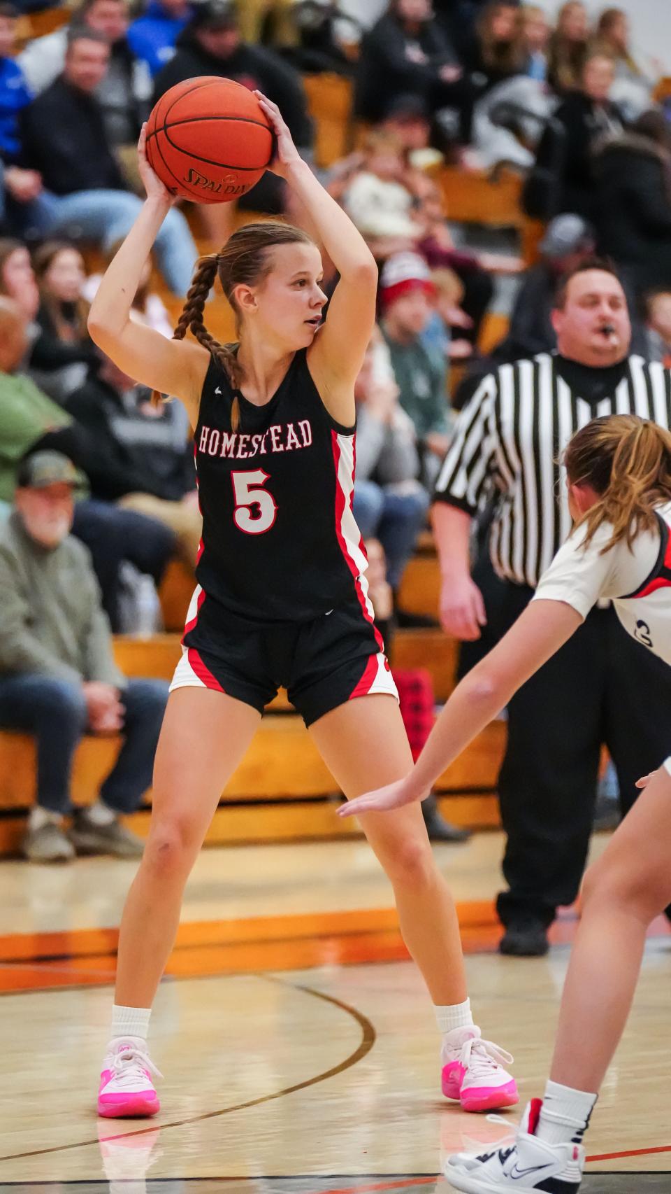 Homestead's Natalie Mueller (5) looks to pass during the game at Cedarburg on Friday, Dec. 1, 2023.