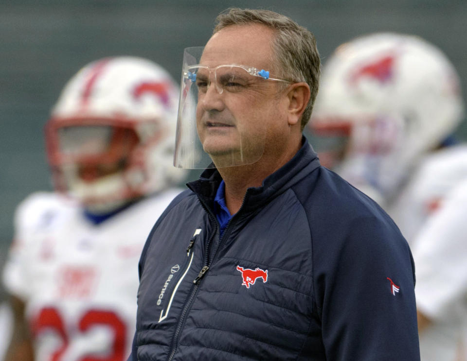 FILE - In this Oct. 16, 2020, file photo, SMU head coach Sonny Dykes watches his team during an NCAA college football game against Tulane in New Orleans. A meeting of undefeated Group of Five teams when No. 9 Cincinnati plays the No. 16 Mustangs on Saturday, Oct. 24, 2020, the American Athletic Conference’s top defense trying to stop one of the league's best offenses, and the first game matching Top 25 teams since SMU (5-0, 3-0 AAC) resumed playing on campus three decades ago. (AP Photo/Matthew Hinton, File)