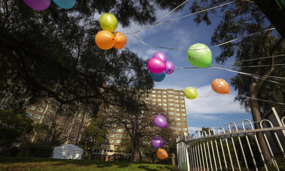 Balloons are seen on the fence at the locked down public housing tower at 33 Alfred Street in North Melbourne.