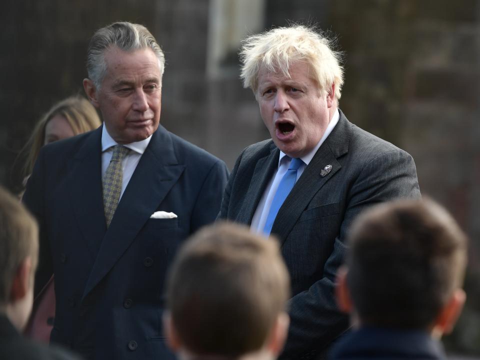 Johnson speaks with schoolchildren following the centenary of Northern Ireland at Saint Patrick’s Church of Ireland Cathedral in Armagh (Getty)