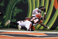 Cleveland Browns' David Njoku, top, makes a touchdown reception against Cincinnati Bengals' Vonn Bell (24) during the second half of an NFL football game, Sunday, Oct. 25, 2020, in Cincinnati. (AP Photo/Michael Conroy)