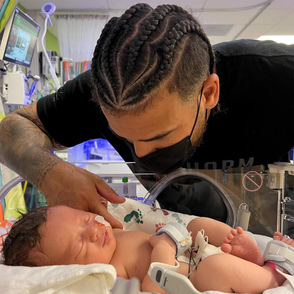 Cory Wharton and newborn baby