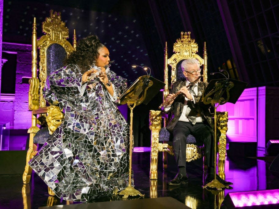 Lizzo and James Galway perform onstage during the 2023 Met Gala
