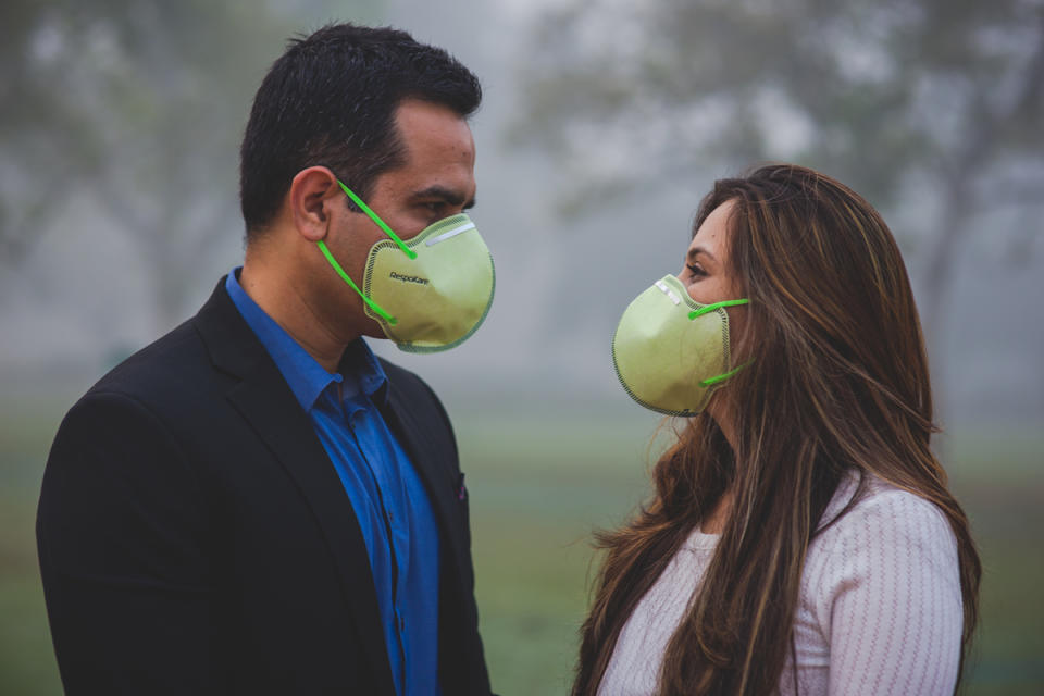 Face masks helped the couple breathe better in the polluted New Delhi air. (Photo: Banjara Studios)