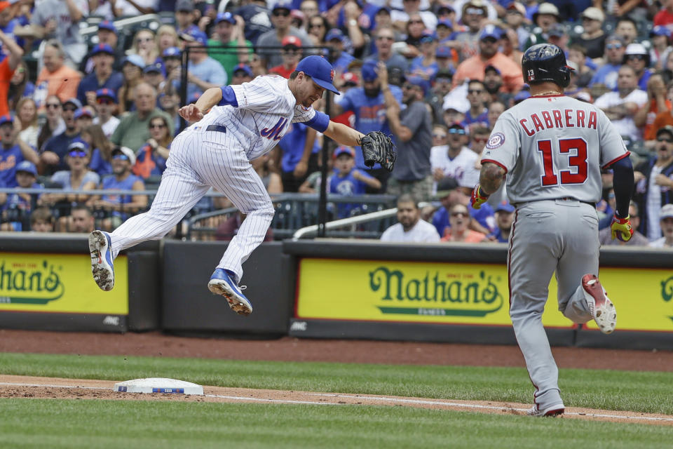 CORRECTS TO NATIONALS' ASDRUBAL CABRERA NOT BOB HENLEY - Washington Nationals' Asdrubal Cabrera (13) watches as New York Mets starting pitcher Jacob deGrom loses control of the ball on a throwing error by first baseman Pete Alonso during the first inning of a baseball game Sunday, Aug. 11, 2019, in New York. Three runs scored on the play. (AP Photo/Frank Franklin II)