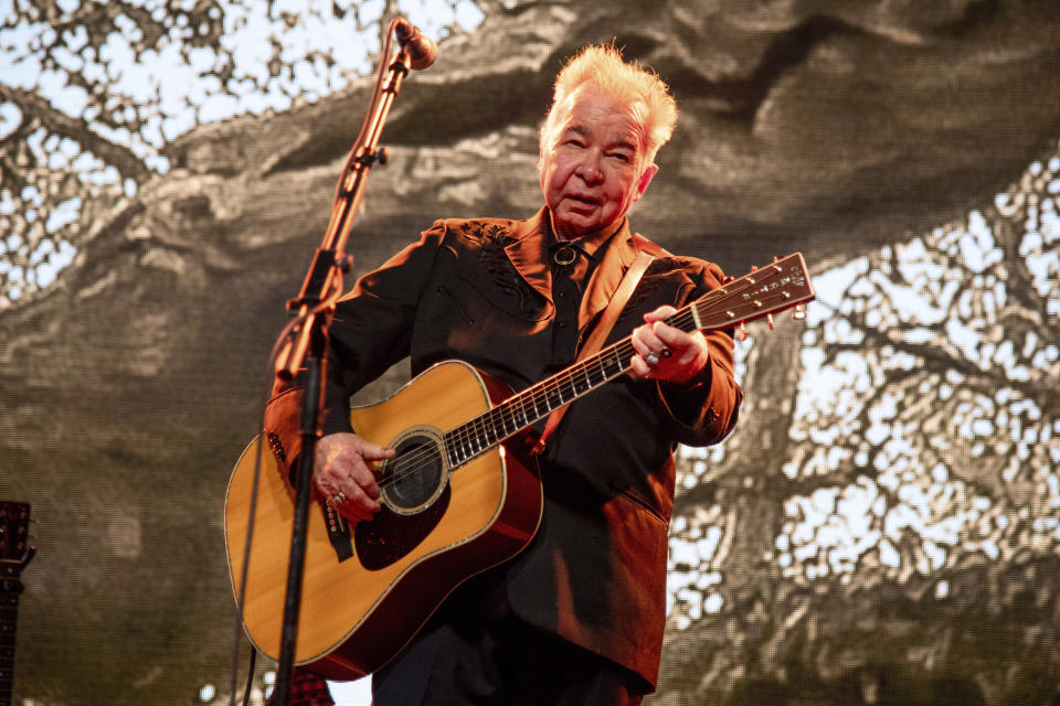 FILE - This June 15, 2019 file photo shows John Prine performing at the Bonnaroo Music and Arts Festival in Manchester, Tenn. Prine died Tuesday, April 7, 2020, from complications of the coronavirus. He was 73. (Photo by Amy Harris/Invision/AP, File)