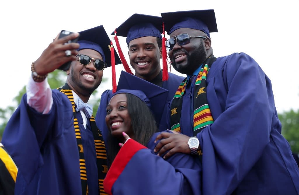 Members of the class of 2016 take a selfie during the 2016 commencement ceremony at Howard University May 7, 2016 in Washington, DC. (Photo by Alex Wong/Getty Images)