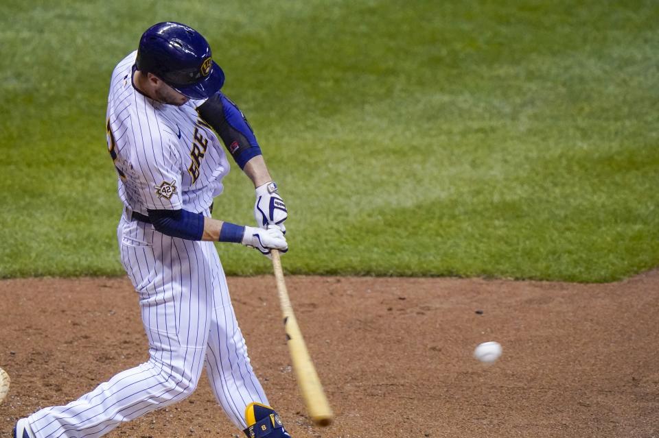 Milwaukee Brewers' Ryan Braun hits a three-run home run during the third inning of a baseball game against the Pittsburgh Pirates Friday, Aug. 28, 2020, in Milwaukee. (AP Photo/Morry Gash)
