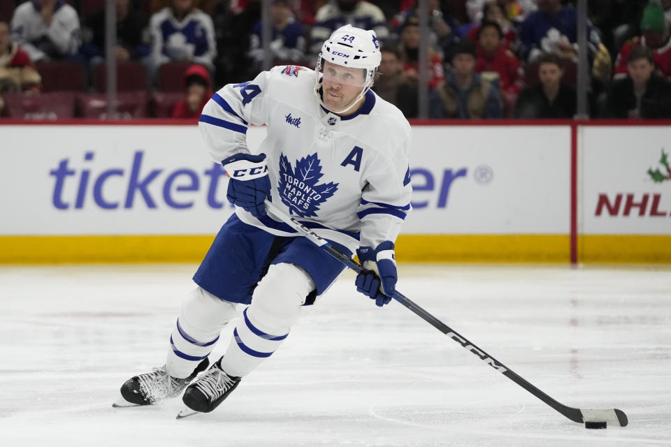 Toronto Maple Leafs defenseman Morgan Rielly handles the puck during the second period of an NHL hockey game against the Chicago Blackhawks Friday, Nov. 24, 2023, in Chicago. (AP Photo/Erin Hooley)