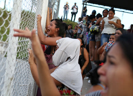 Relatives of inmates react in front of a prison complex in the Brazilian state of Amazonas after prisoners were found strangled to death in four separate jails, according to the penitentiary department in Manaus, Brazil May 27, 2019. REUTERS/Bruno Kelly