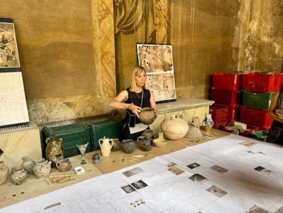 PHOTO: Archeologist and medieval history expert Ilaria de Luca displays items found at the excavation site. (Phoebe Natanson/ABC News)