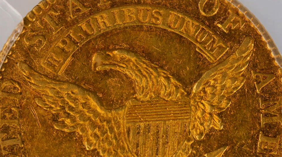 This image taken from video provided by Stack's Bowers Galleries shows the back of a 1822 Half Eagle $5 piece gold coin from the D. Brent Pogue Collection that was sold at Stack's Bowers Galleries in Las Vegas. The coin trading world has a new gold standard, after the only known 1822 half eagle $5 piece in private hands sold at auction in Las Vegas for $8.4 million, experts said Friday, March 26, 2021. (Stack's Bowers Galleries via AP)