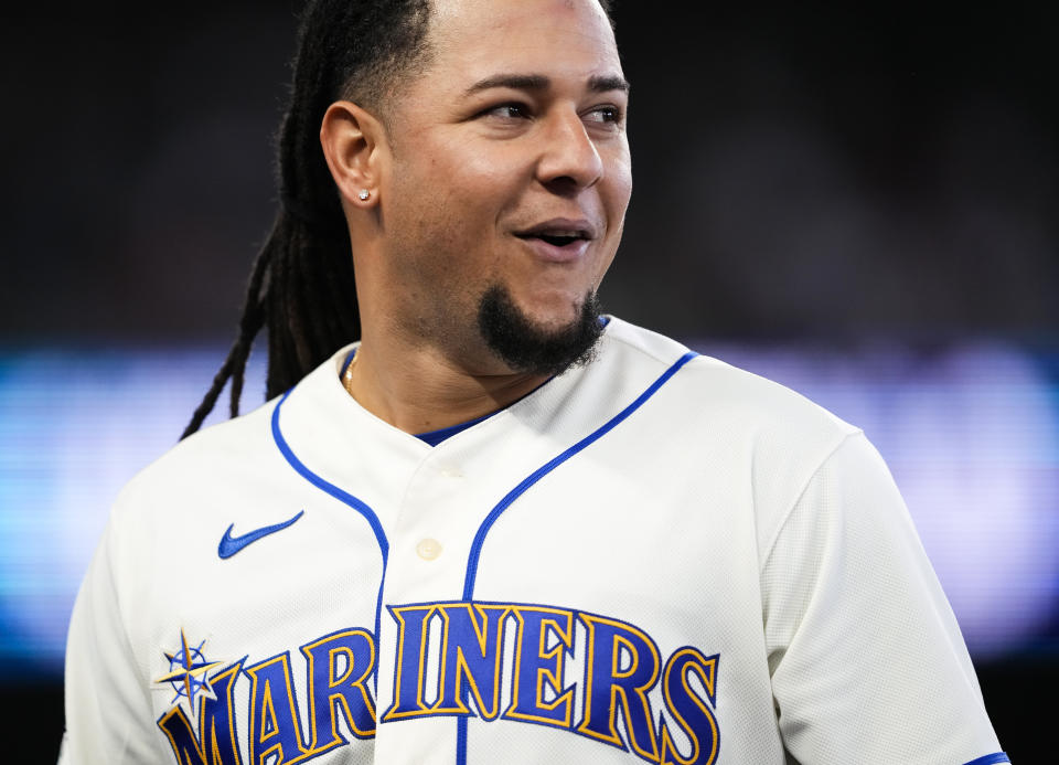 Seattle Mariners starting pitcher Luis Castillo smiles after pitching through the sixth inning against the Colorado Rockies without giving up a hit in a baseball game, Sunday, April 16, 2023, in Seattle. (AP Photo/Lindsey Wasson)