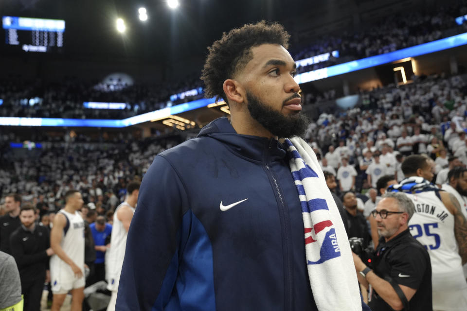 Minnesota Timberwolves center Karl-Anthony Towns walks off the court after Game 5 of the Western Conference finals in the NBA basketball playoffs against the Dallas Mavericks, Thursday, May 30, 2024, in Minneapolis. The Mavericks won 124-103, taking the series 4-1 and moving on to the NBA Finals. (AP Photo/Abbie Parr)