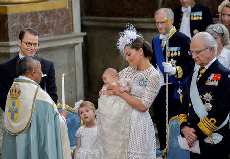 Crown Princess Victoria holds Prince Oscar, during his christening, while Princess Estelle looks on at the Royal Palace's Chapel in Stockholm, Sweden May 27, 2016. TT News Agency/Jonas Ekstromer/via REUTERS