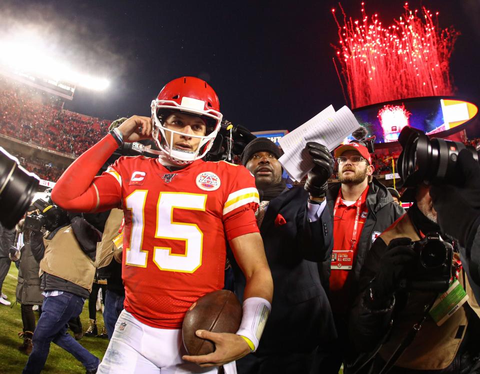 Fireworks go off as Kansas City Chiefs quarterback Patrick Mahomes (15) celebrates after defeating the Houston Texans in a AFC Divisional Round playoff football game at Arrowhead Stadium.
