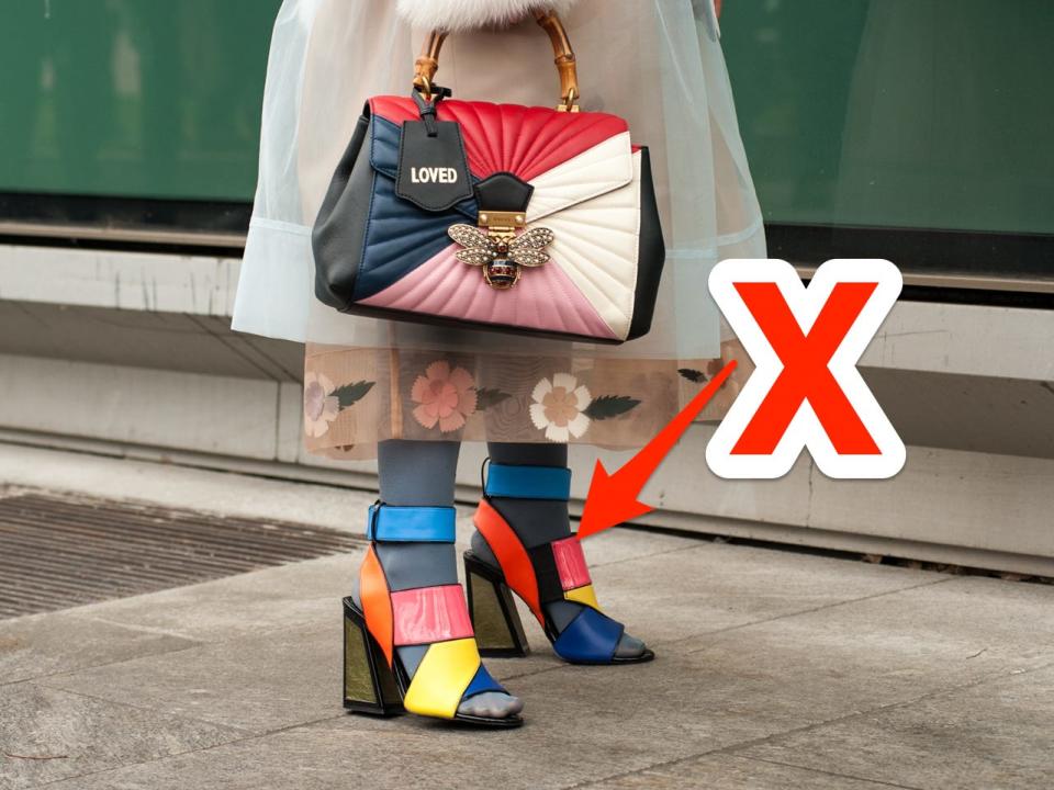 red x and arrow pointing at pair of chunky colorful heels someone is wearing with tights and a dress