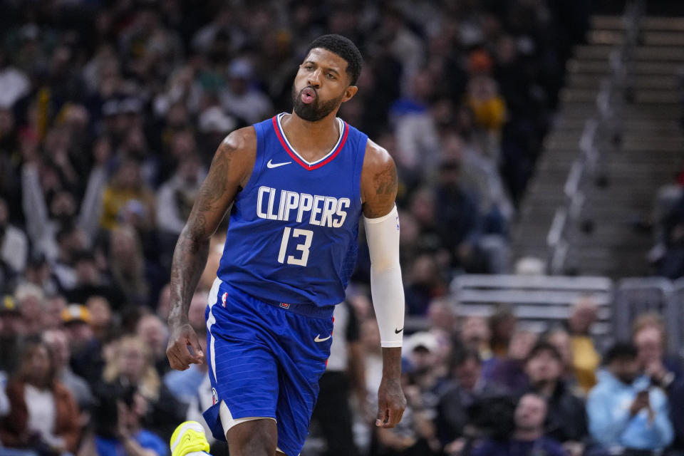 Los Angeles Clippers forward Paul George (13) reacts after a shot against the Indiana Pacers during the first half of an NBA basketball game in Indianapolis, Monday, Dec. 18, 2023. (AP Photo/Michael Conroy)