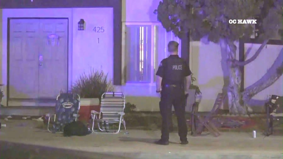 Police investigate outside a Huntington Beach apartment complex where a mass stabbing left two people dead and three others hospitalized on July 4, 2024. (OC Hawk)