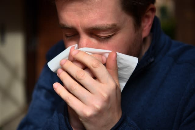 The virus is spread through cough or sneeze droplets, so make sure you catch them in a tissue you then throw away