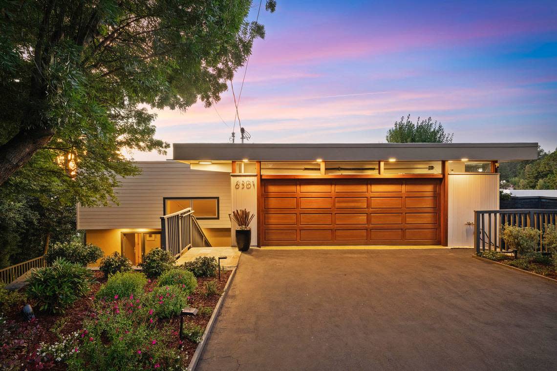 The Norther California residence with a glass terrace looks understated from the front.