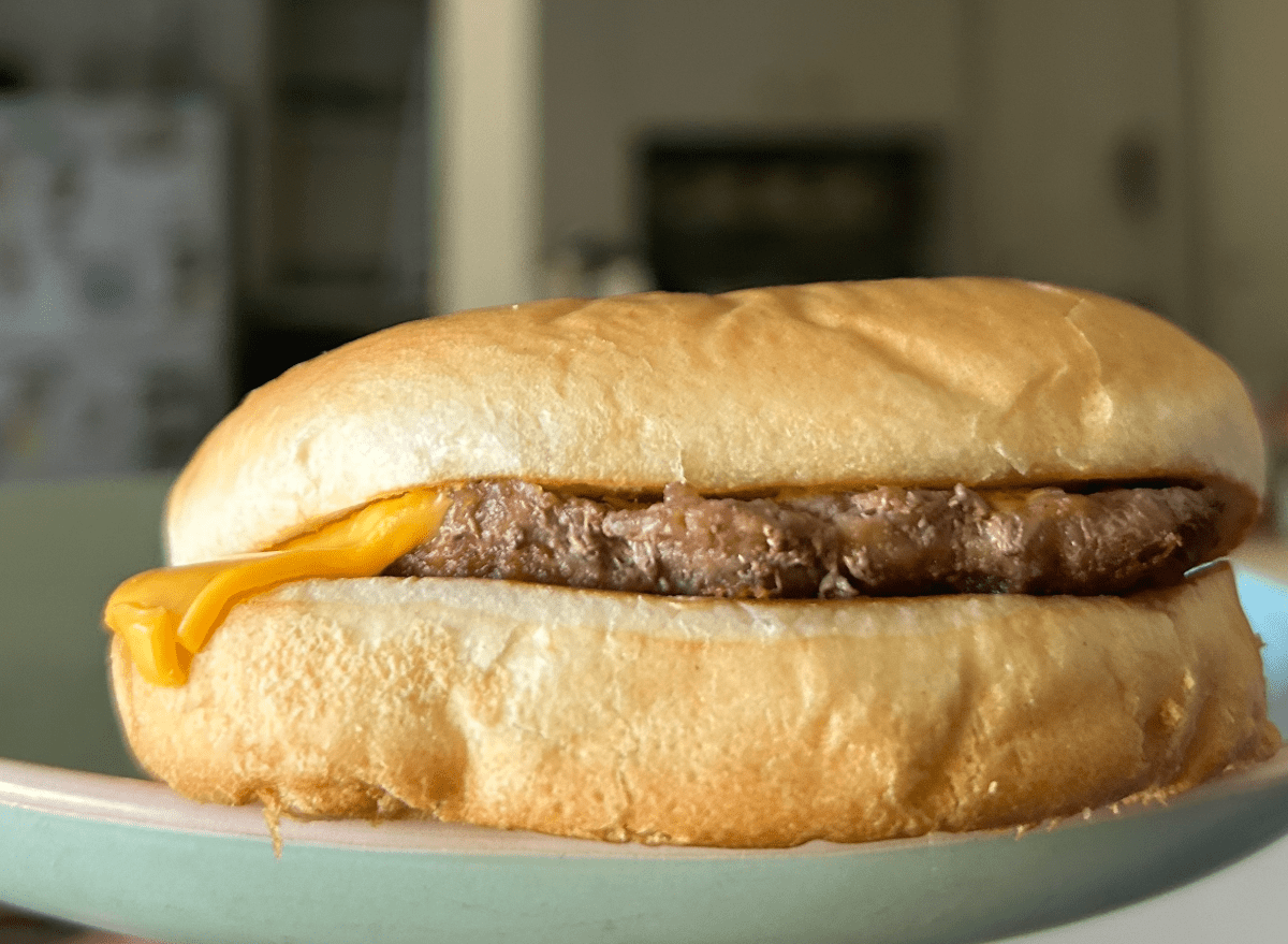 jack in the box cheeseburger on a plate. 