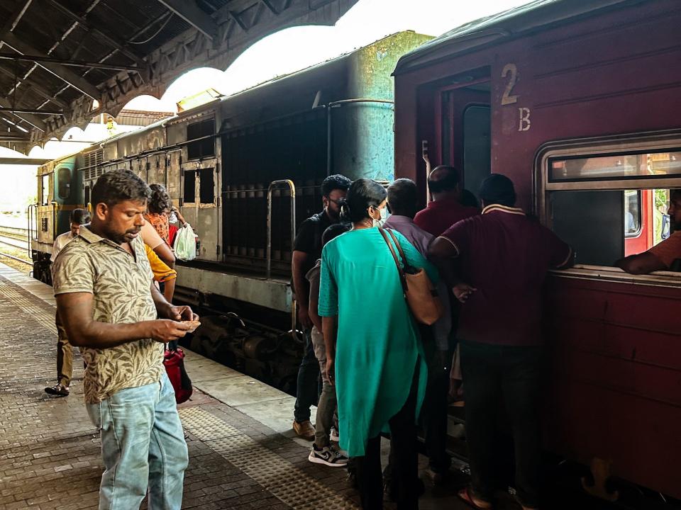 people getting on a train