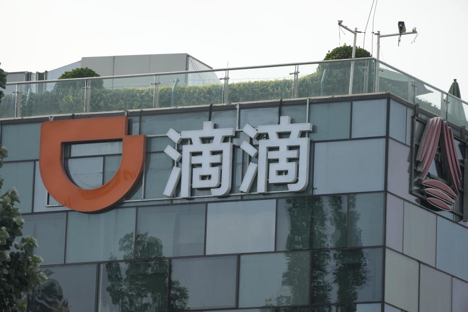The sign for Didi is seen at the top of its head office in Beijing Friday, July 16, 2021. China's cyber-watchdog on Friday announced an on-site cybersecurity investigation of ride-hailing service Didi, stepping up scrutiny after earlier criticism of its handling of customer information caused the company's New York-traded shares to tumble. (AP Photo/Ng Han Guan)