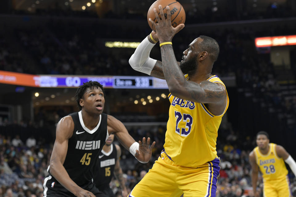 Los Angeles Lakers forward LeBron James (23) shoots against Memphis Grizzlies forward GG Jackson II (45) during the first half of an NBA basketball game Wednesday, March 27, 2024, in Memphis, Tenn. (AP Photo/Brandon Dill)