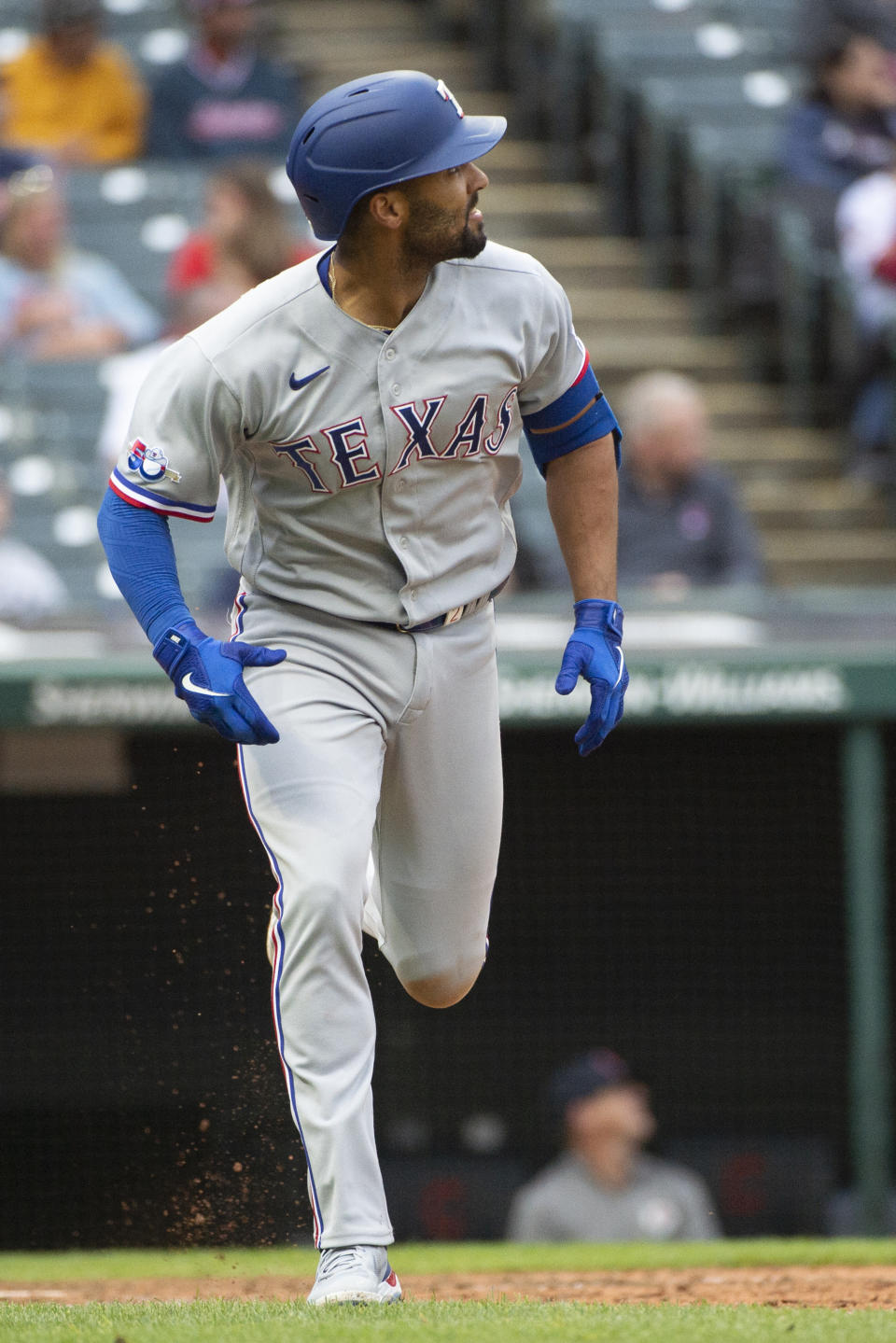 Texas Rangers' Marcus Semien watches his solo home run off Cleveland Guardians starting pitcher Cal Quantrill during the seventh inning of the first game of a baseball doubleheader in Cleveland, Tuesday, June 7, 2022. (AP Photo/Phil Long)