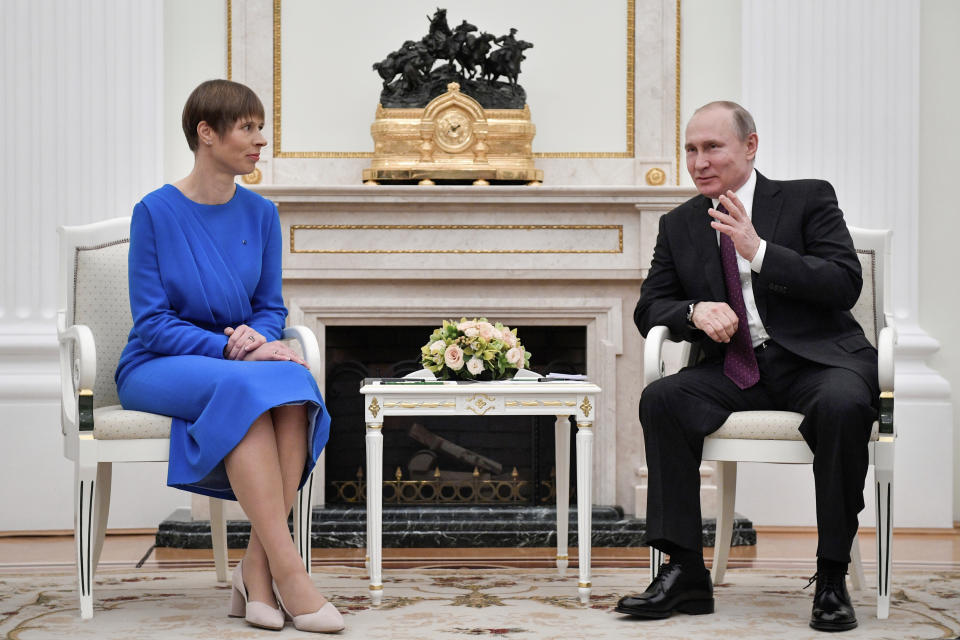Russian President Vladimir Putin, right, gestures as he speaks to Estonia's President Kersti Kaljulaid at the Kremlin in Moscow, Russia, Thursday, April 18, 2019. Thursday's meeting between the presidents of Russia and Estonia is the first one for the leaders of the two neighbouring countries for nearly a decade. (Alexander Nemenov/Pool Photo via AP)