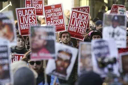 Black Lives Matter protesters gather in Westlake Park near Westlake Mall during Black Friday in Seattle, Washington November 27, 2015. REUTERS/David Ryder