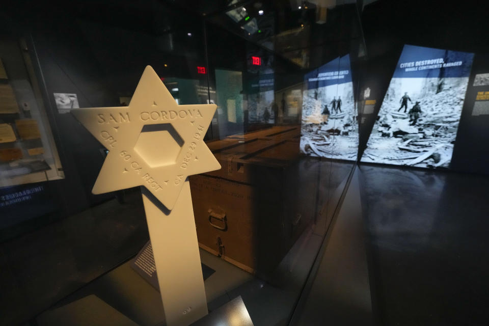 A reproduction of the headstone of Army Corporal Sam Cordova, who was serving with the 60th Coastal Artillery Regiment in the Philippines when he was killed in action on Dec. 29, 1941, is part of the new pavilion of the National World War II Museum, in New Orleans, Tuesday, Oct. 31, 2023. The latest major addition to the museum is called the Liberation Pavilion. And it's ambitious in scope. The grim yet hopeful addition addresses the conflict's world-shaping legacy. (AP Photo/Gerald Herbert)