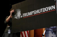 <p>A Senate staffer places a sign blaming U.S. President Donald Trump for shutdown of the Federal Government before a news conference with Senate Minority Leader Chuck Schumer on Capitol Hill in Washington, Jan. 20, 2018. (Photo: Joshua Roberts/Reuters) </p>