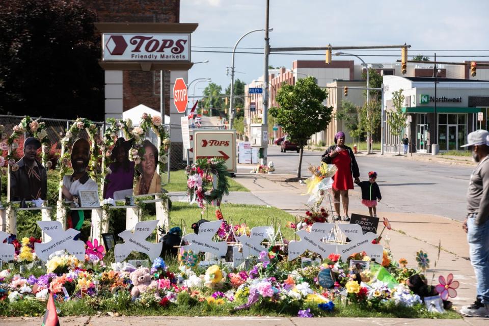 A makeshift memorial for victims of the Tops supermarket massacre recognises the 10 Black people killed in a racist attack in Buffalo, New York. (Getty Images)