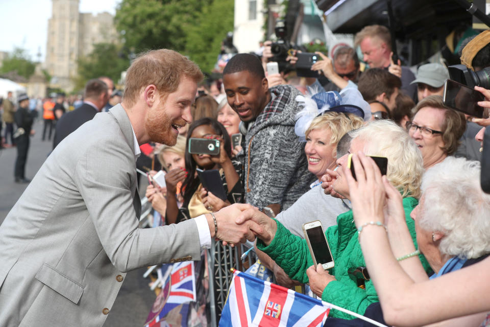 Prince Harry greets fans outside Windsor Castle ahead of his wedding to Meghan Markle this weekend. (Photo: Jonathan Brady/pool via Reuters)