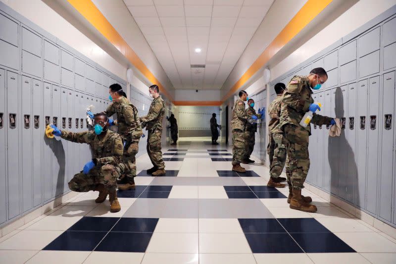 Members of Joint Task Force 2, composed of soldiers and airmen from the New York Army and Air National Guard, work to sanitize the New Rochelle High School during the coronavirus disease (COVID-19) outbreak in New Rochelle, New York