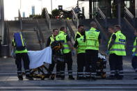 Emergency services at the Field's shopping center after a shooting, in Copenhagen, Denmark, Sunday, July 3, 2022. Danish police say several people have been shot at a Copenhagen shopping mall. Copenhagen police said that one person has been arrested in connection with the shooting at the Field’s shopping mall on Sunday. Police tweeted that “several people have been hit” but gave no other details. (Olafur Steinar Gestsson/Ritzau Scanpix via AP)