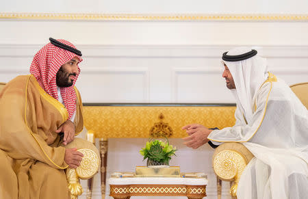 Abu Dhabi's Crown Prince Sheikh Mohammed bin Zayed al-Nahyan talks with Saudi Arabia's Crown Prince Mohammed bin Salman Al Saud in Abu Dhabi, UAE, November 22, 2018. Picture taken November 22, 2018. Bandar Algaloud/Courtesy of Saudi Royal Court/Handout via REUTERS