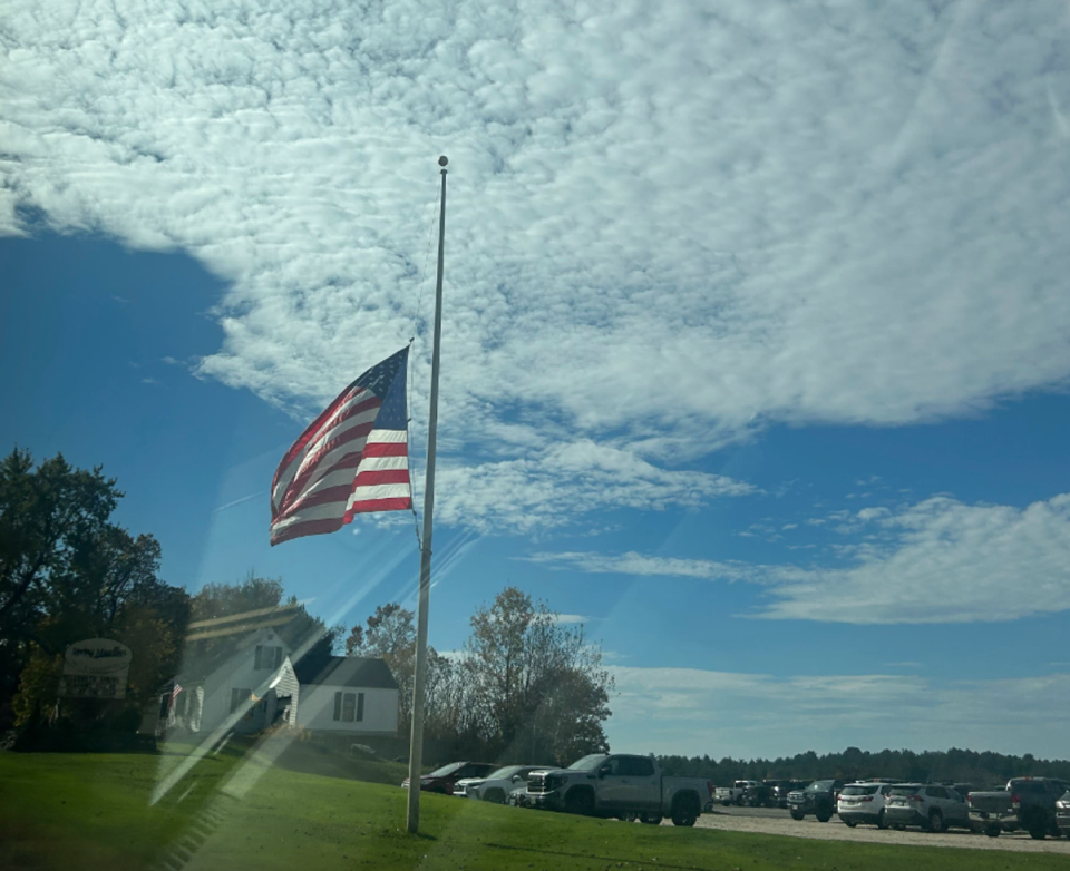 A flag at half-mast in Lewsiton, where a gunman killed 18 people and injured a dozen on Wednesday night (Andrea Blanco)