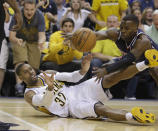 Indiana Pacers' C.J. Watson makes a pass while being defended by Atlanta Hawks' Shelvin Mack during the first half in Game 2 of an opening-round NBA basketball playoff series Tuesday, April 22, 2014, in Indianapolis. (AP Photo/Darron Cummings)