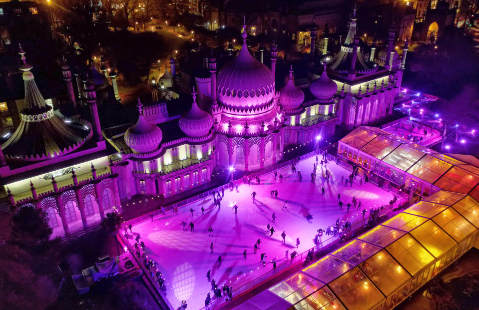 Brighton's Royal Pavilion forms a stunningly festive backdrop for ice skating in this image.