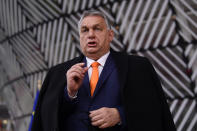 Hungary's Prime Minister Viktor Orban speaks as he arrives for an EU summit at the European Council building in Brussels, Thursday, Dec. 10, 2020. European Union leaders meet for a year-end summit that will address anything from climate, sanctions against Turkey to budget and virus recovery plans. Brexit will be discussed on the sidelines. (John Thys, Pool via AP)