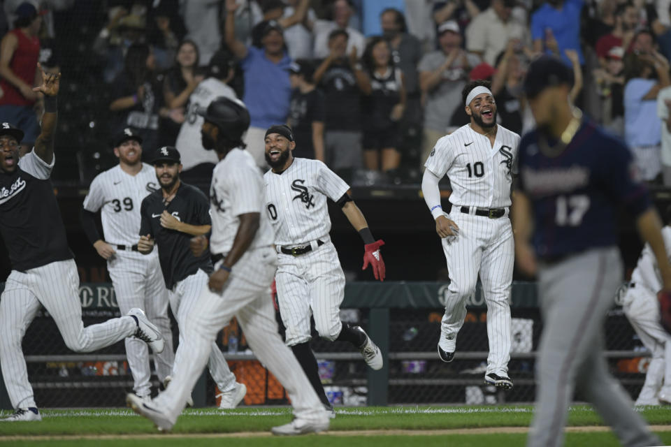 Chicago White Sox players celebrate after Gavin Sheets hit a walk-off three-run home run to defeat the Minnesota Twins in a baseball game Monday, July 19, 2021, in Chicago. (AP Photo/Paul Beaty)