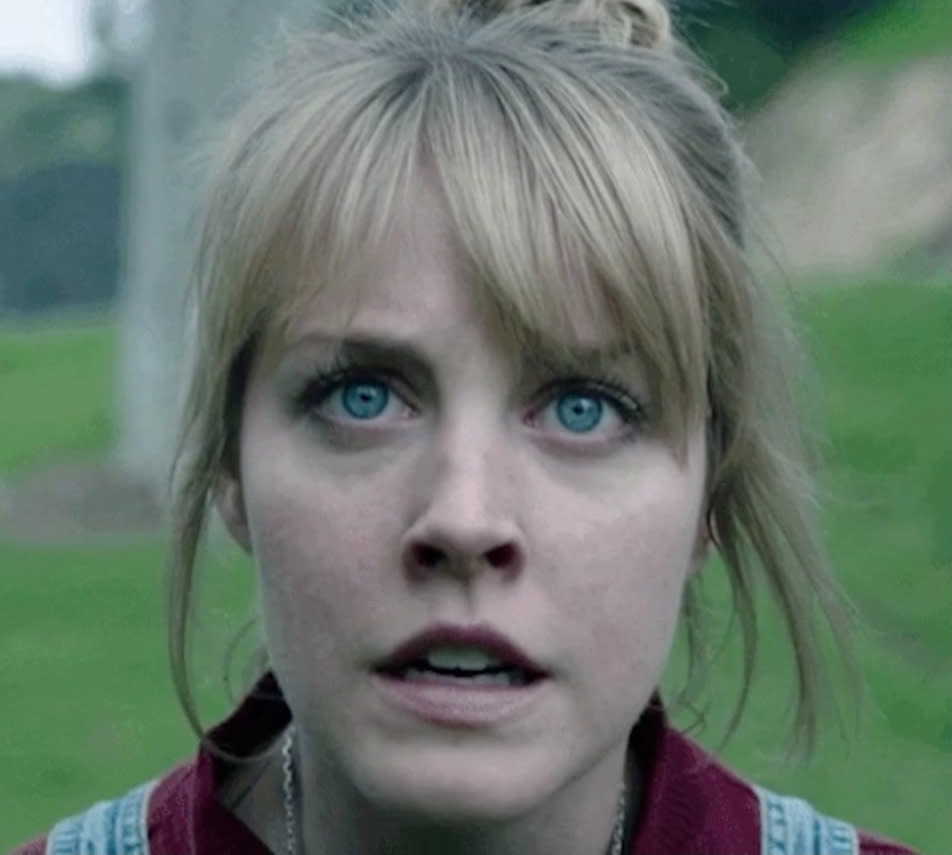 Close-up of a worried Bryce Dallas Howard's character in a scene