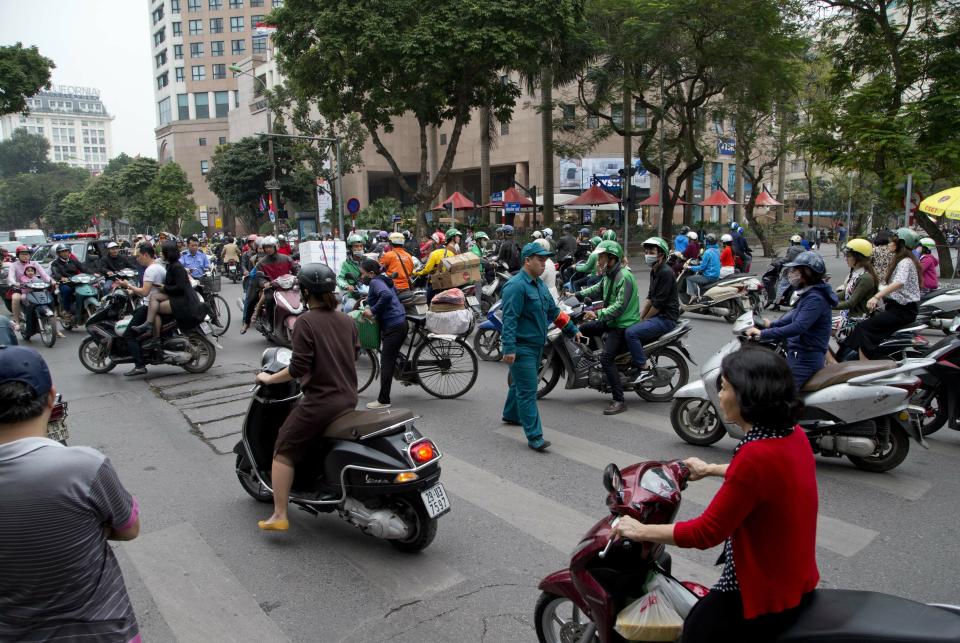 Vehicle starts to move after roads reopened following the motorcade of North Korean leader Kim Jong Un was driven off Melia hotel in Hanoi, Vietnam, Saturday, March 2, 2019. (AP Photo/Gemunu Amarasinghe)