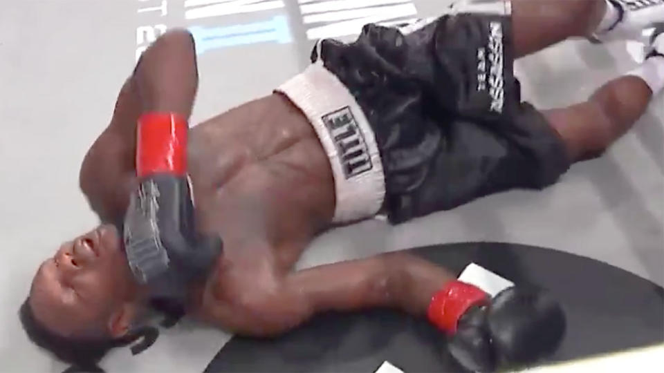 Pictured here, Eric Walker lay on the canvas after a ninth round hit from Israil Madrimov. 