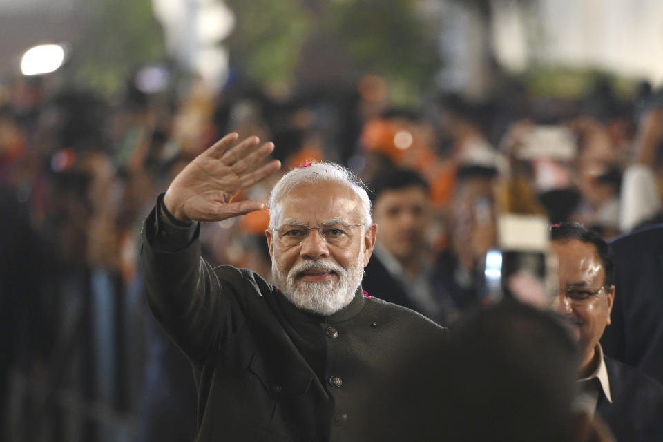 Indian Prime Minister Narendra Modi greets party worker during celebrations following Bharatiya Janata Party's victory in the state elections at the BJP headquarters in New Delhi, India, Sunday, Dec. 3, 2023. India's Hindu nationalist party was headed for a clear win in three out of four states Sunday, according to the election commission's website. (AP Photo)