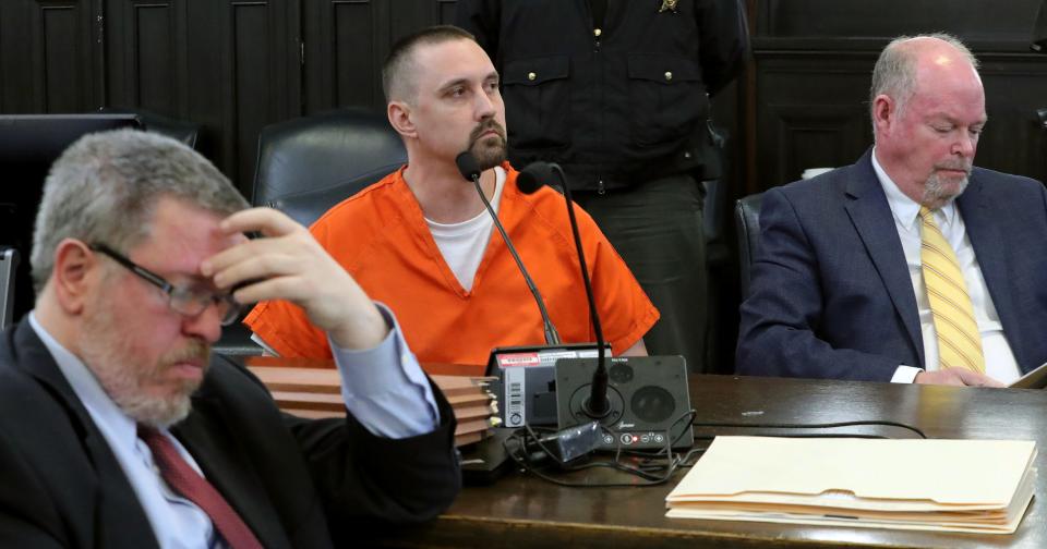 Defendant Jason Turkovich, center, looks on as Judge Kathryn Michael goes over his charges before sentencing him to prison Thursday for shooting Kayla Holt and Teasijah in July 2022.